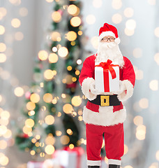 Image showing man in costume of santa claus with gift box