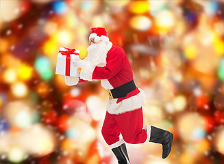 Image showing man in costume of santa claus with gift box