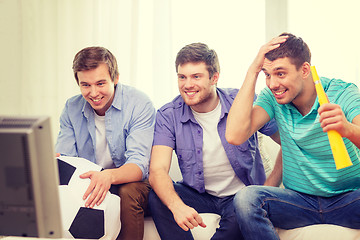 Image showing happy male friends with football and vuvuzela