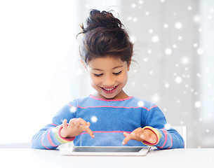 Image showing smiling girl with tablet pc at home