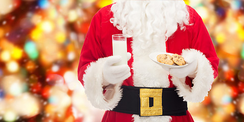 Image showing santa claus with glass of milk and cookies