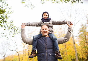 Image showing happy family having fun in autumn park