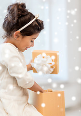 Image showing smiling little girl with gift box