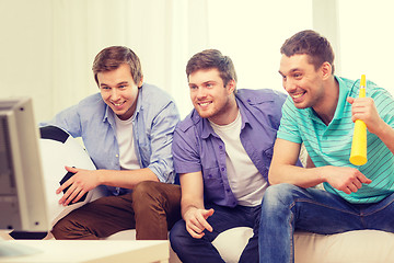 Image showing happy male friends with football and vuvuzela