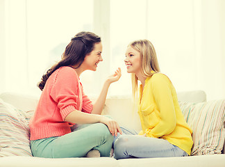 Image showing two girlfriends having a talk at home