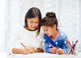 Image showing mother and daughter with coloring pencils indoors