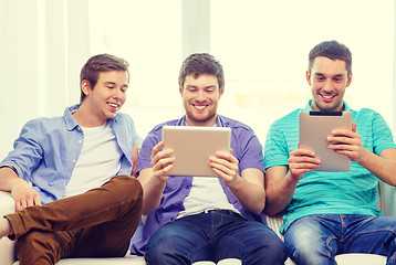 Image showing smiling friends with tablet pc computers at home