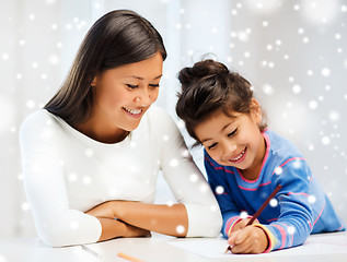 Image showing mother and daughter with coloring pencils indoors