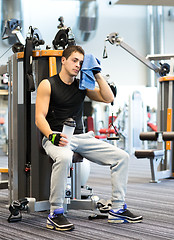 Image showing man exercising on gym machine