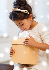 Image showing smiling little girl with gift box