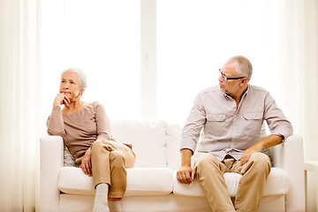 Image showing senior couple sitting on sofa at home