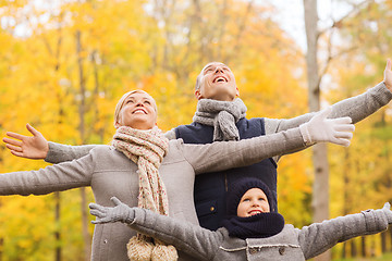 Image showing happy family having fun in autumn park