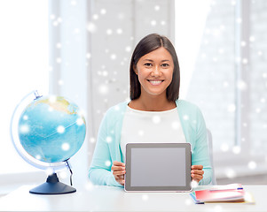 Image showing smiling young woman with globe and tablet pc