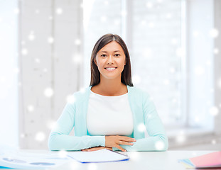 Image showing smiling young woman with globe and tablet pc