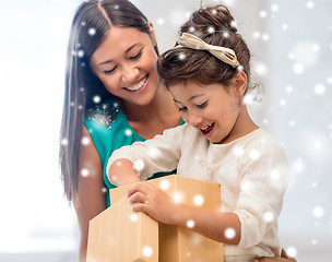 Image showing happy mother and child girl with gift box