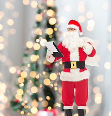 Image showing man in costume of santa claus with notepad and bag