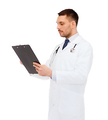 Image showing serious male doctor with clipboard and stethoscope