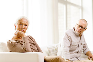 Image showing senior couple sitting on sofa at home