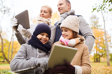 Image showing happy family with tablet pc in autumn park