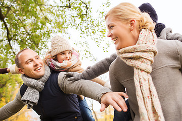 Image showing happy family having fun in autumn park