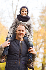 Image showing happy family having fun in autumn park