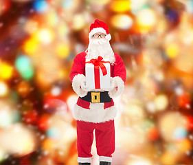 Image showing man in costume of santa claus with gift box