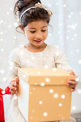 Image showing smiling little girl with gift box