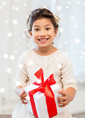 Image showing smiling little girl with gift box