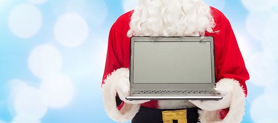 Image showing close up of santa claus with laptop