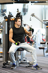 Image showing man exercising on gym machine