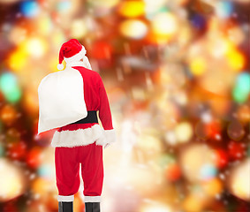 Image showing man in costume of santa claus with bag