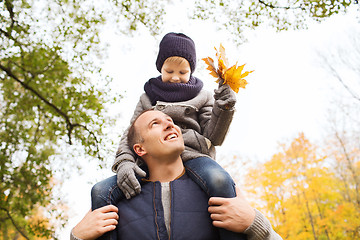 Image showing happy family having fun in autumn park