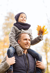 Image showing happy family having fun in autumn park