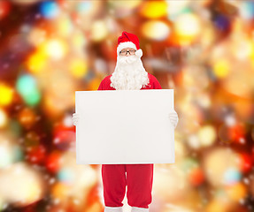 Image showing man in costume of santa claus with billboard