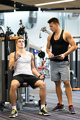 Image showing man exercising on gym machine