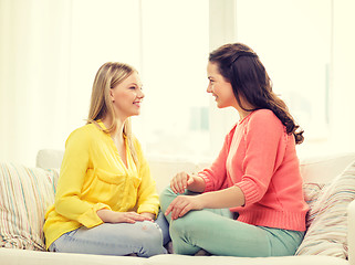 Image showing two girlfriends having a talk at home