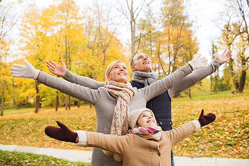 Image showing happy family having fun in autumn park