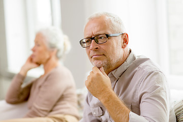 Image showing senior couple sitting on sofa at home