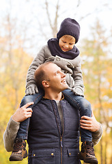 Image showing happy family having fun in autumn park