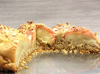 Image showing Cutted  wholemeal apple cake on a cake tray on gray background