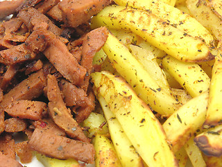 Image showing Soy Geschnetzeltes and french fries als background picture