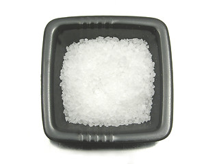 Image showing Black bowl of chinaware with salt on reflecting surface