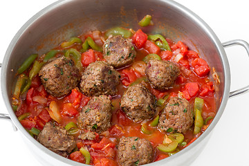 Image showing Meatballs cooking in a sauce