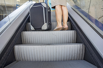 Image showing Woman to escalator