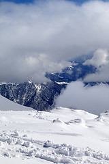 Image showing View on winter snowy mountains in clouds