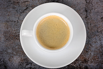 Image showing Cup of fresh coffee on table