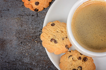 Image showing Cup of fresh coffee with cookies on table