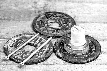 Image showing acupuncture needles on antique chinese coin