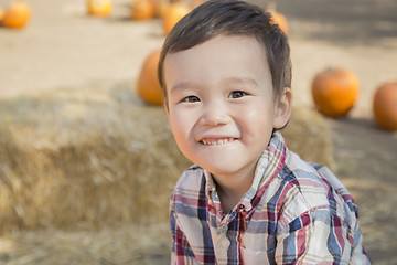 Image showing Mixed Race Young Boy Having Fun at the Pumpkin Patch