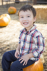 Image showing Mixed Race Young Boy Having Fun at the Pumpkin Patch